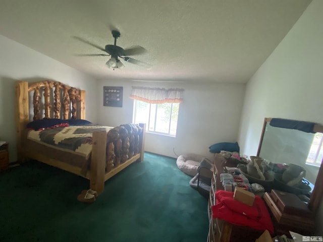 carpeted bedroom featuring a textured ceiling and ceiling fan