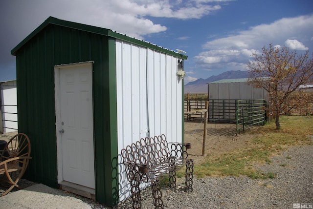 view of outbuilding featuring a mountain view