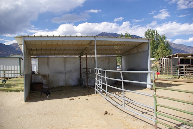 view of stable with a mountain view