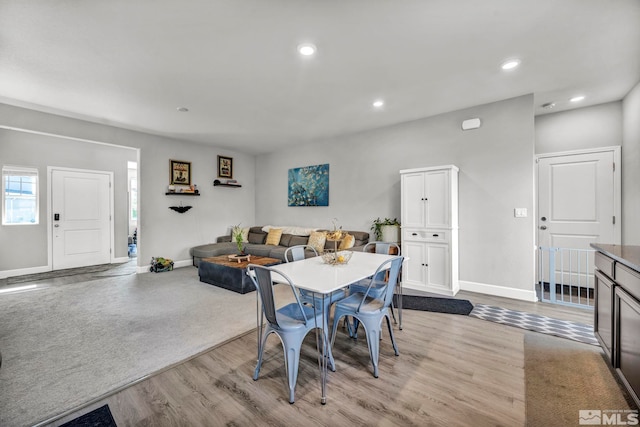 dining area with light wood-type flooring