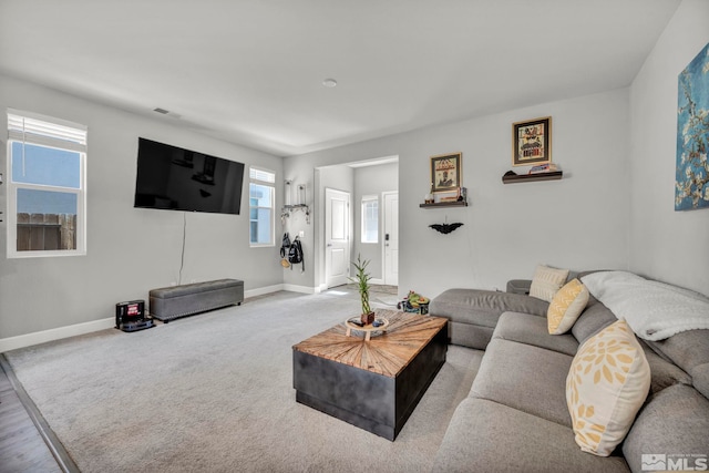 living room featuring light hardwood / wood-style flooring and plenty of natural light