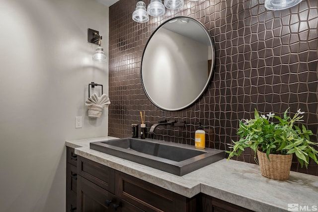 bathroom featuring backsplash and vanity