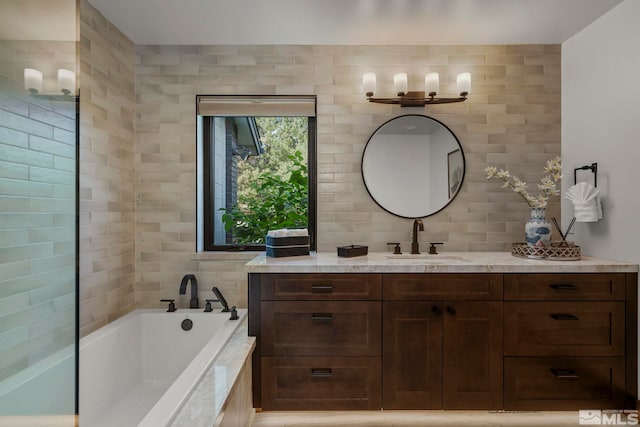 bathroom with a bathtub and vanity