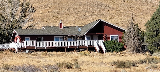 rear view of house with a deck