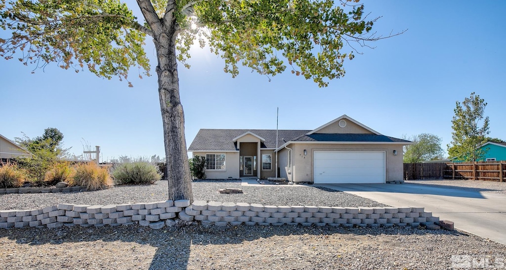 ranch-style home featuring a garage