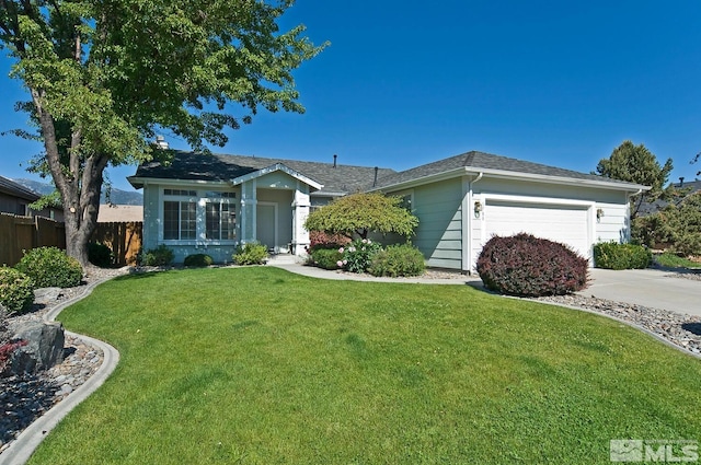 ranch-style home featuring concrete driveway, roof with shingles, a front lawn, a garage, and fence