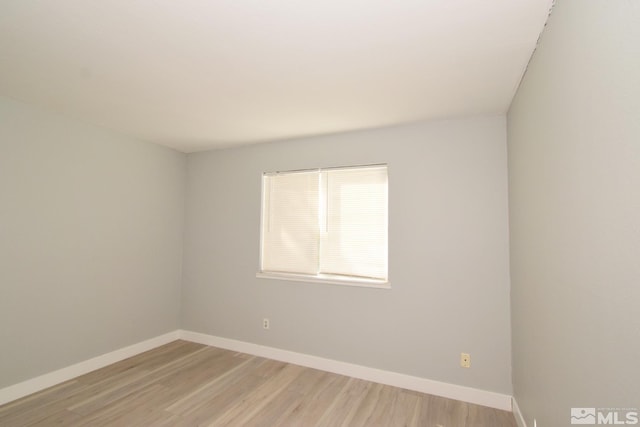 empty room with light hardwood / wood-style floors