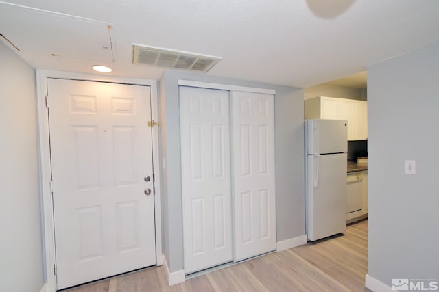 entrance foyer featuring light hardwood / wood-style floors