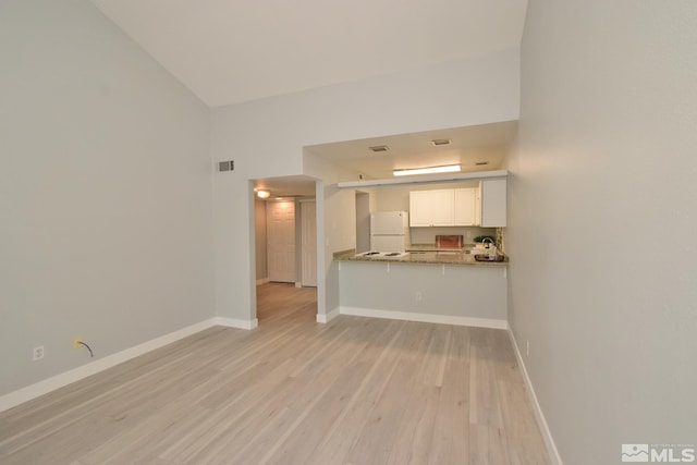 unfurnished living room featuring light hardwood / wood-style floors