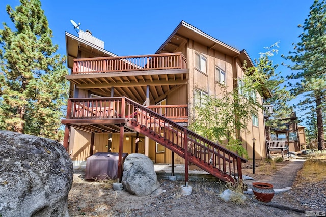 rear view of property with a deck