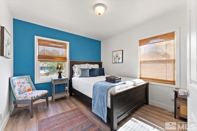 bedroom featuring dark hardwood / wood-style flooring