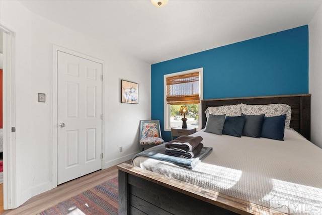 bedroom with wood-type flooring