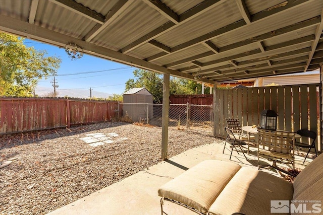 view of patio featuring a shed