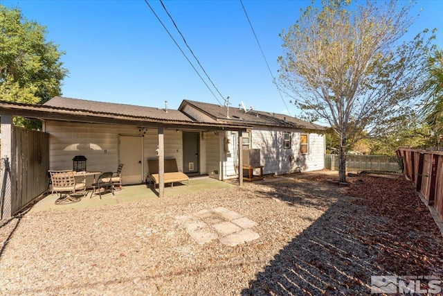 back of property featuring a patio area