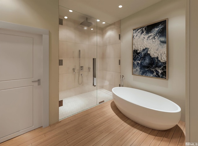 bathroom featuring hardwood / wood-style floors and independent shower and bath