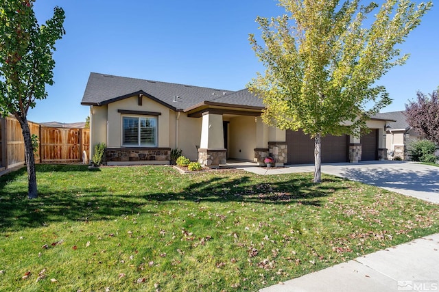 view of front of property featuring a front lawn and a garage