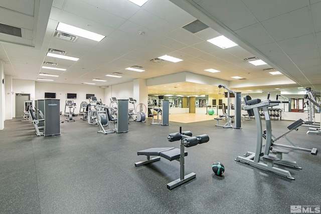 workout area with visible vents and a drop ceiling