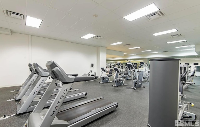 workout area featuring visible vents and a drop ceiling