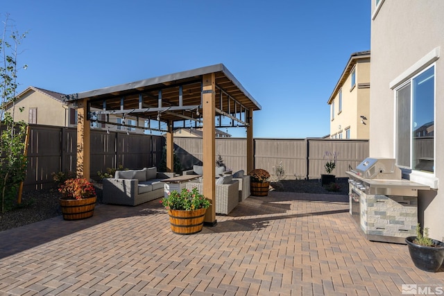 view of patio / terrace featuring an outdoor hangout area and exterior kitchen