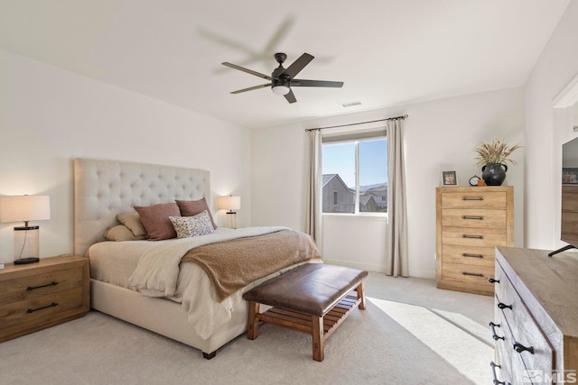 bedroom featuring light colored carpet and ceiling fan