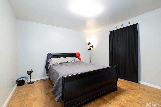 bedroom with light hardwood / wood-style floors