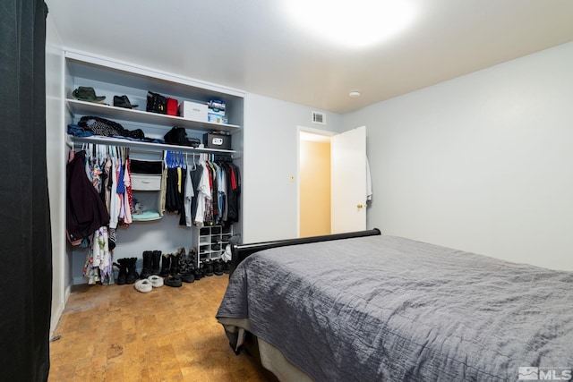 bedroom featuring a closet and light wood-type flooring