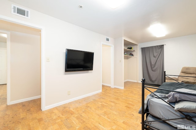 unfurnished bedroom featuring a closet and light hardwood / wood-style flooring