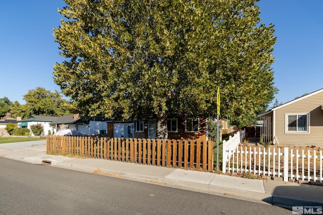 view of property hidden behind natural elements