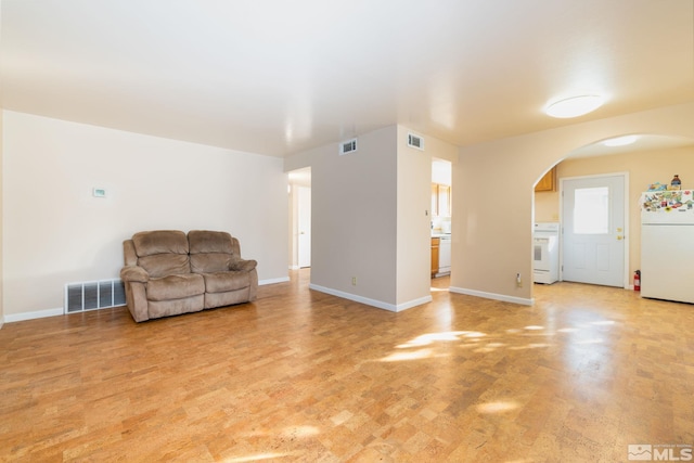 sitting room with light colored carpet