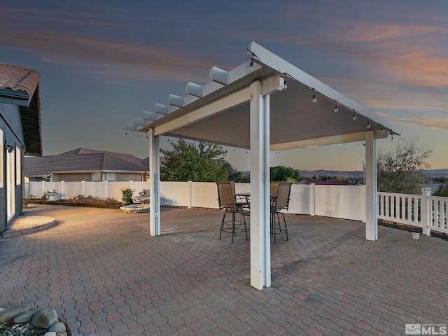 patio terrace at dusk with a gazebo