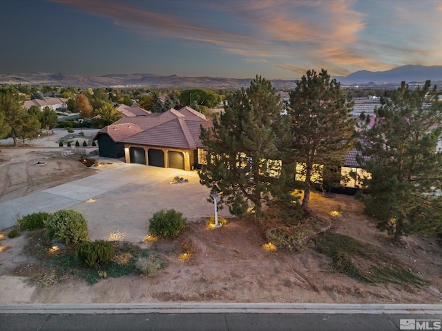 view of front of house featuring a mountain view and a garage