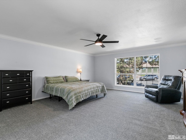 bedroom featuring carpet floors, ornamental molding, and ceiling fan