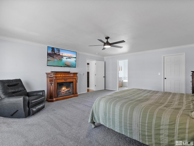 bedroom featuring ceiling fan, connected bathroom, ornamental molding, and carpet