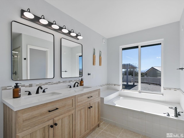 bathroom with tile patterned floors, vanity, and plus walk in shower