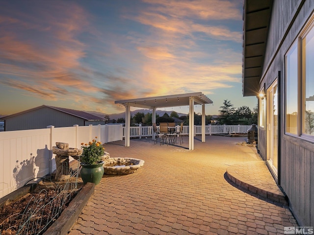 view of patio terrace at dusk