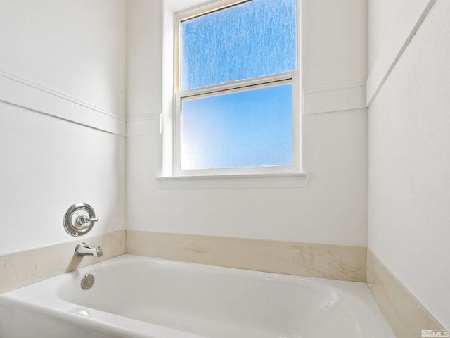 bathroom with a washtub