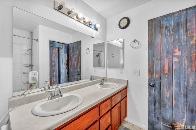 bathroom with vanity and a shower with shower curtain