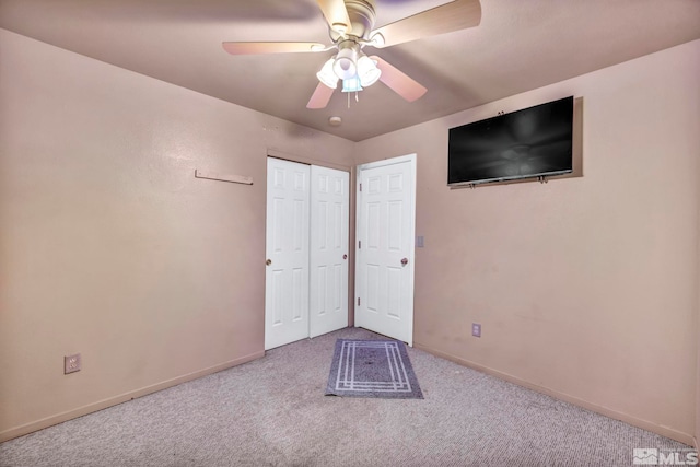 carpeted empty room with ceiling fan