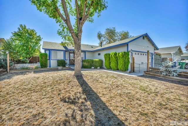 ranch-style house featuring a garage