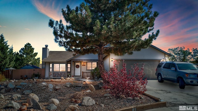 view of front of property with a garage