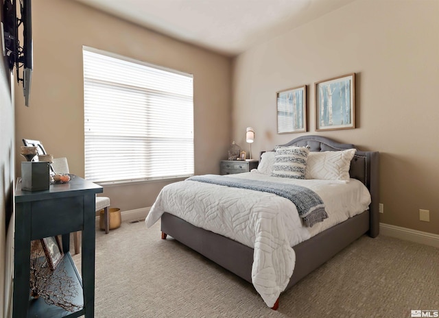 bedroom with light carpet