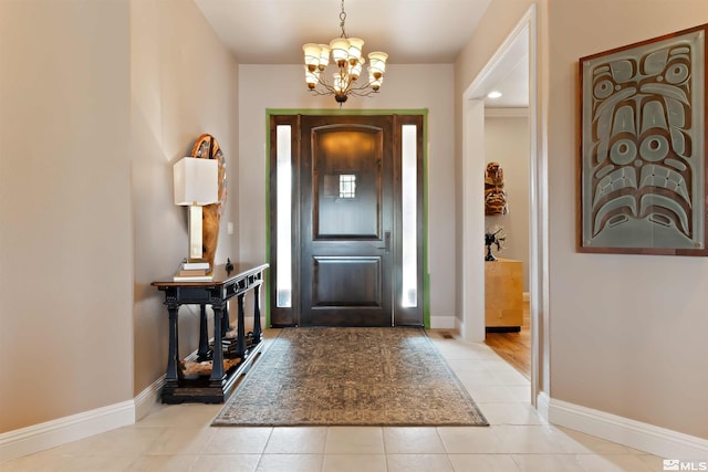 tiled entrance foyer featuring a chandelier and a healthy amount of sunlight