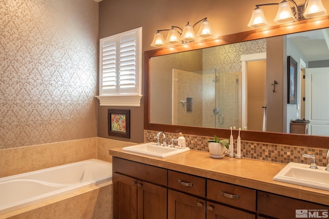 bathroom featuring vanity, separate shower and tub, and backsplash