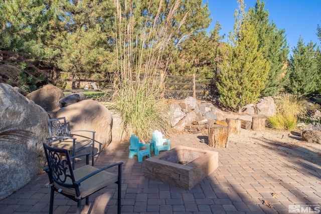 view of patio / terrace with an outdoor fire pit