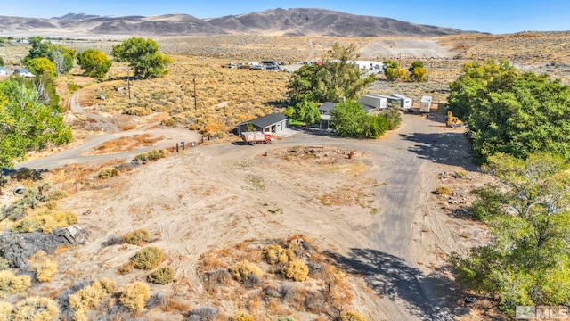 birds eye view of property featuring a mountain view