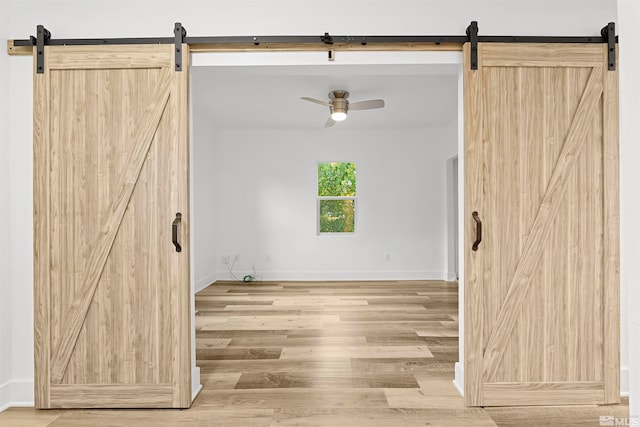 empty room with wood-type flooring and ceiling fan