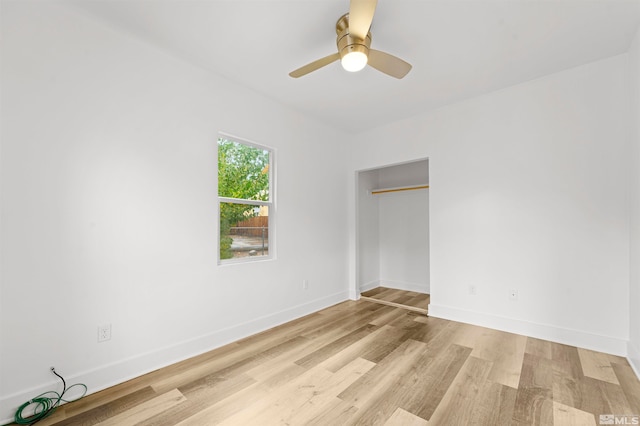 unfurnished bedroom featuring ceiling fan and light wood-type flooring