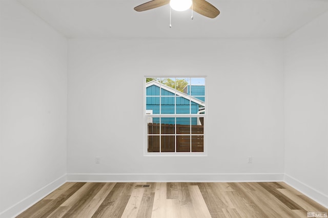 empty room featuring ceiling fan and light wood-type flooring