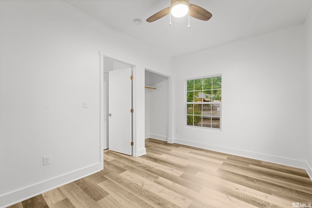 unfurnished bedroom featuring light hardwood / wood-style floors and ceiling fan