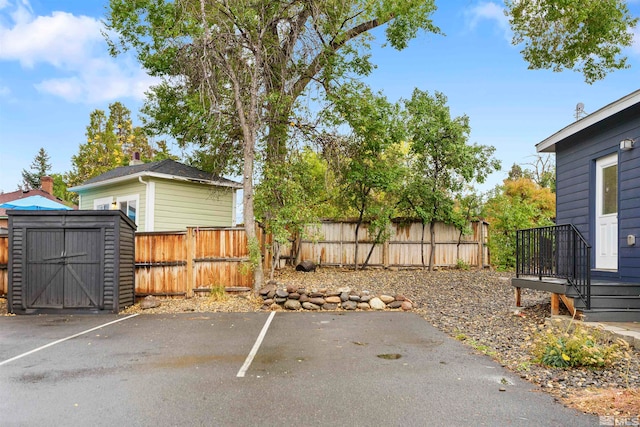 exterior space with a shed